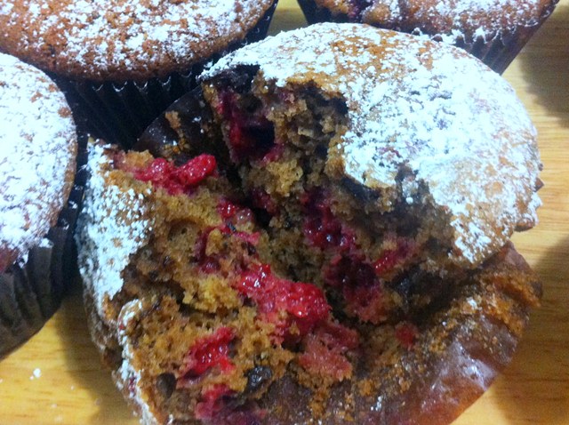 Double Chocolate Hermann Happiness. Muffins with Raspberries, Almonds, Dutch Cocoa and Choc Chunks.